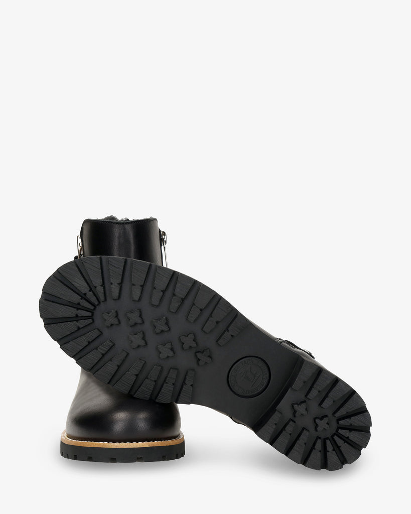 Fiore Trav botas de piel con forro interior de pelo. negro